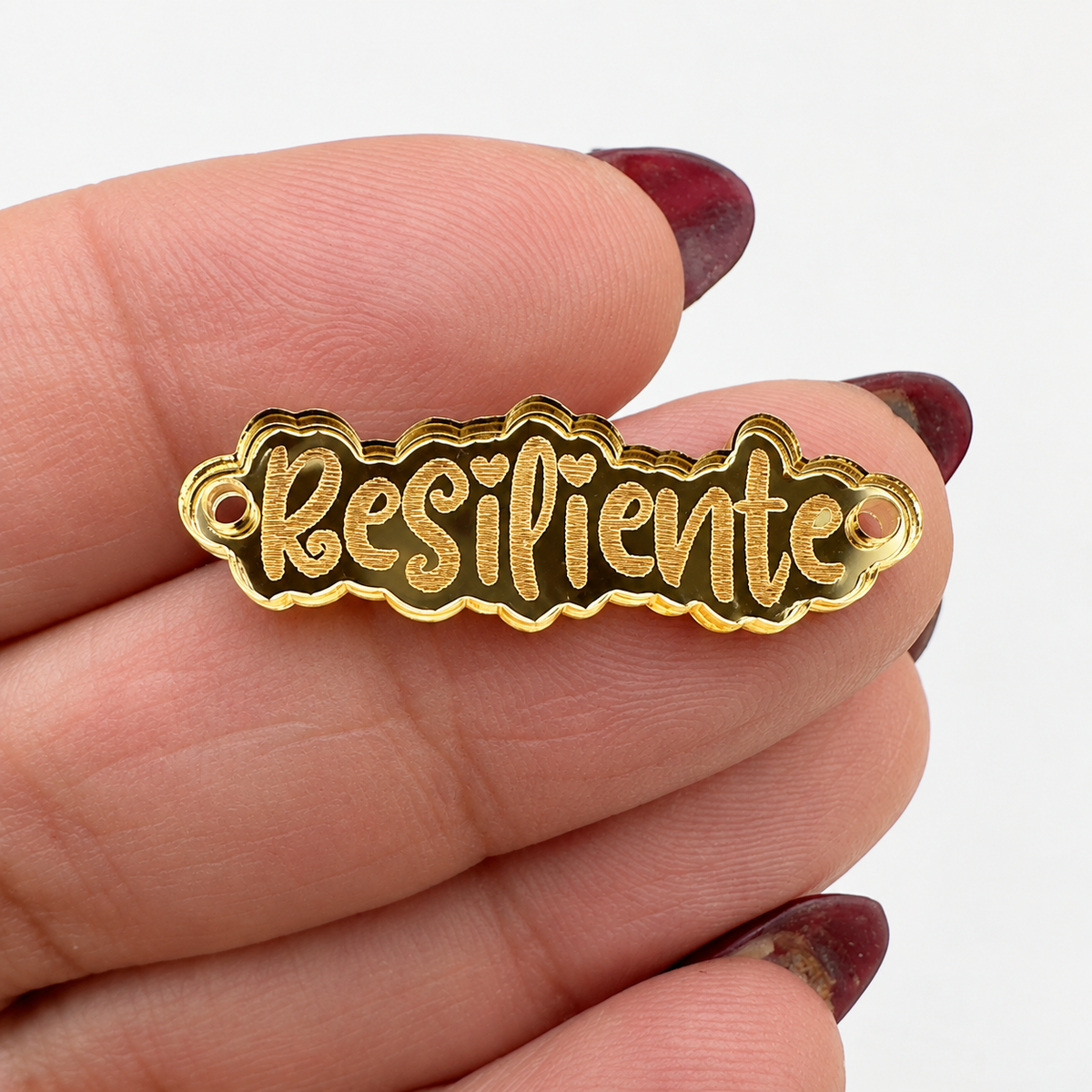 Frase  “Resiliente” conector en acrílico